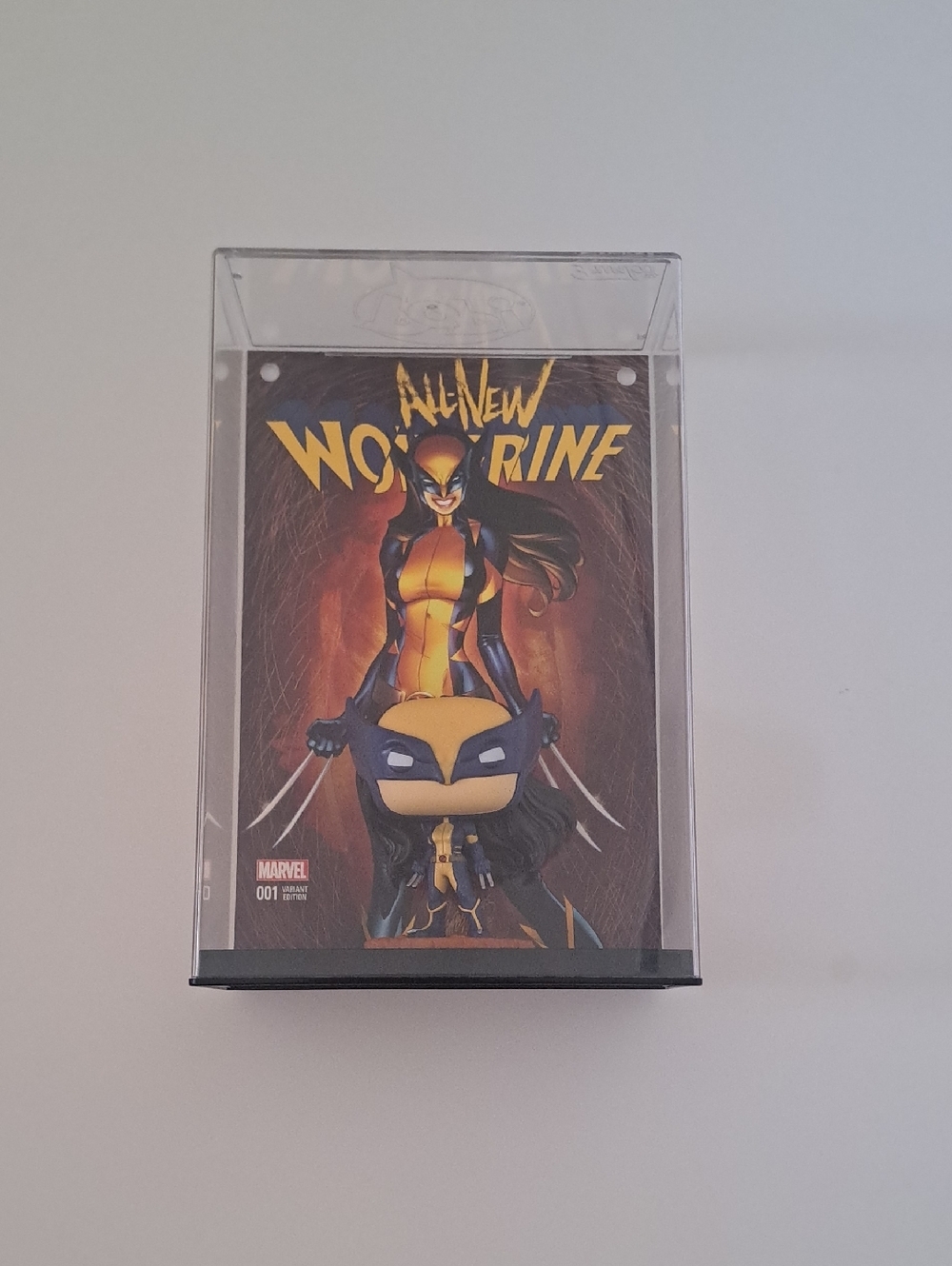 Marvel Wolverine Artwork And Funko Pop